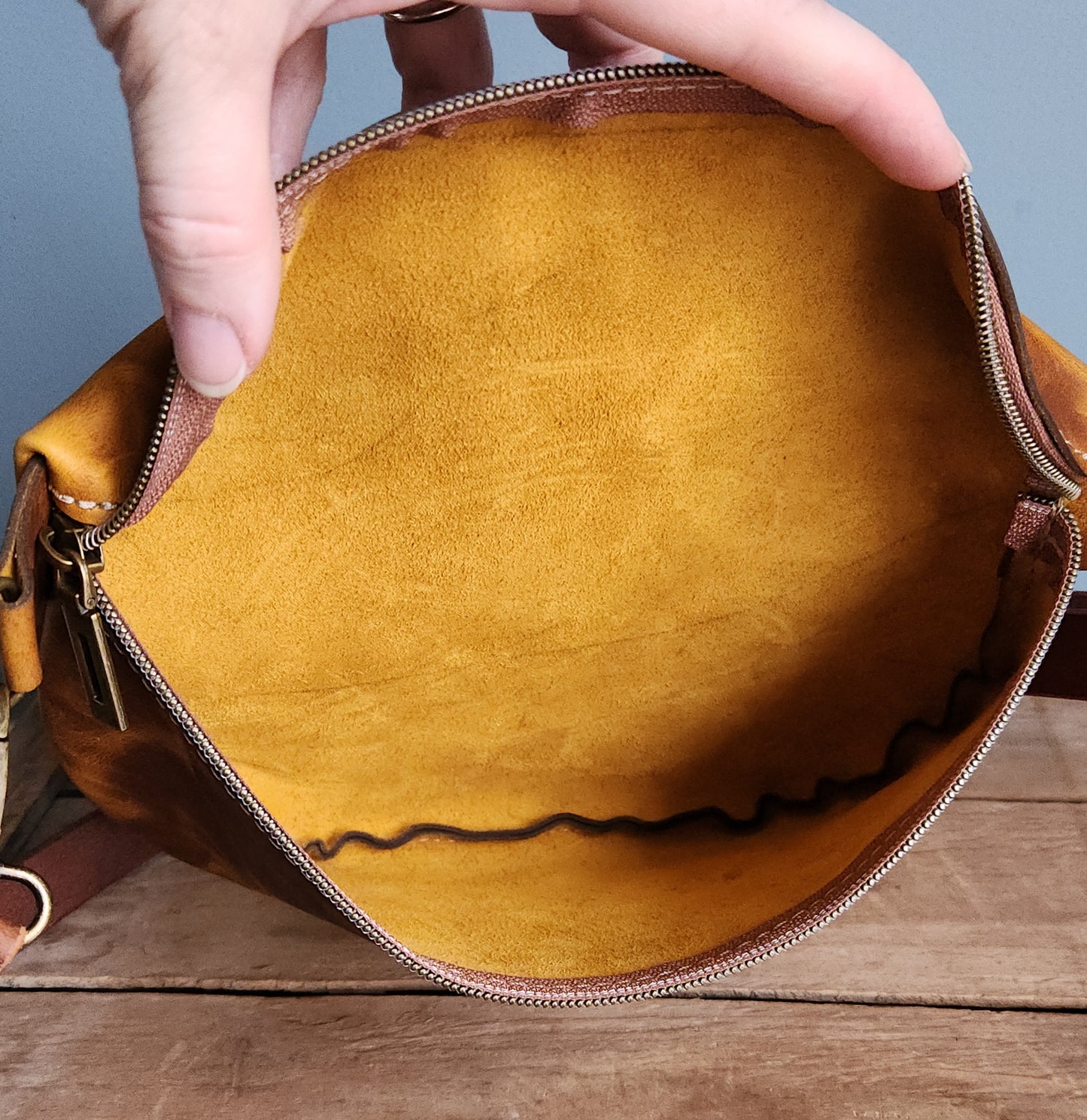 Papaya large leather sling bag