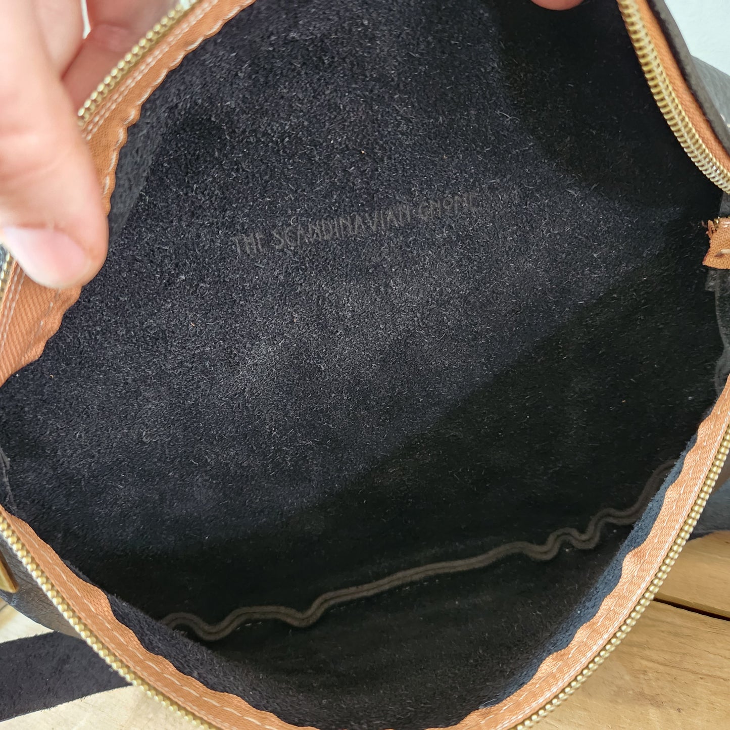 Soft textured black large sling bag