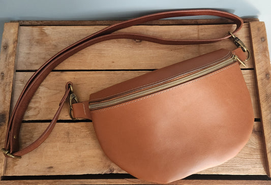 Rigid brown leather large sling bag